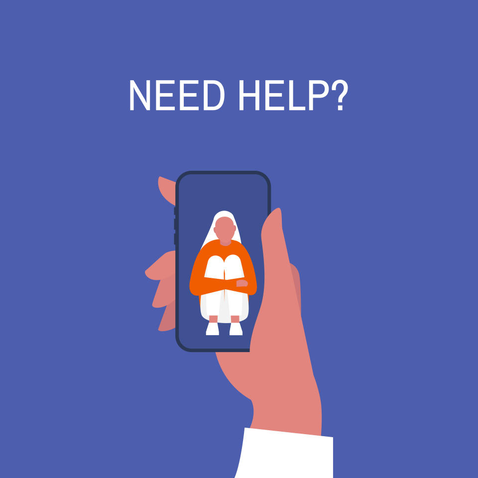 Crisis hotline. Need help? Hand holding a smartphone. New technologies. Therapy. Appointment. Mental health. Millennials. Young lonely female character hugging her knees.