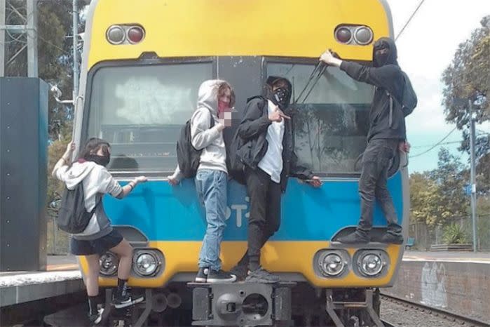 Members of the Sky High Idiots pose on the back of a Melbourne train. Source: Instagram