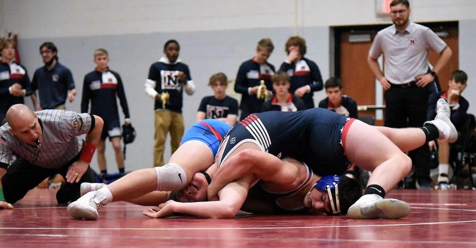 Senior Jerry McBee (182) looks for the pin against this Terre Haute North opponent.