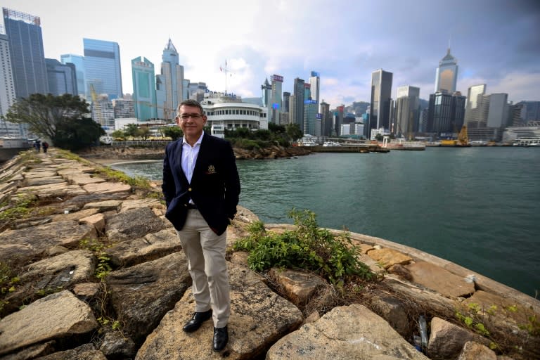 Robert Stoneley, commodore of the Royal Yacht Club, stands in front of the historic club