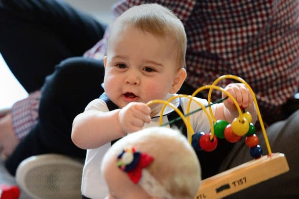 Prince George plays with toys as the Duke and Duchess of Cambridge and Prince George visit Plunket, a child welfare group at Government House, Wellington, during their official tour to New Zealand.   PRESS ASSOCIATION Photo. Picture date: Friday March 14, 2014. See PA story ROYAL Tour. Photo credit should read: Anthony Devlin/PA Wire