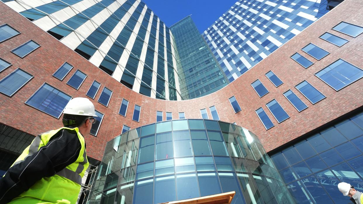 Dr. Andrew Thomas, Chief Clinical Officer of The Ohio State University Wexner Medical Center and Senior Associate VP for Health Sciences, looks up at the new 26-story inpatient tower at the hospital.