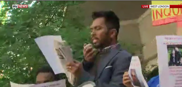 The man addresses the crowd outside the town hall. (Sky)