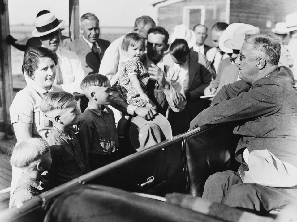 President Franklin Roosevelt talks to a family devastated by the drought in Colorado in 1936.