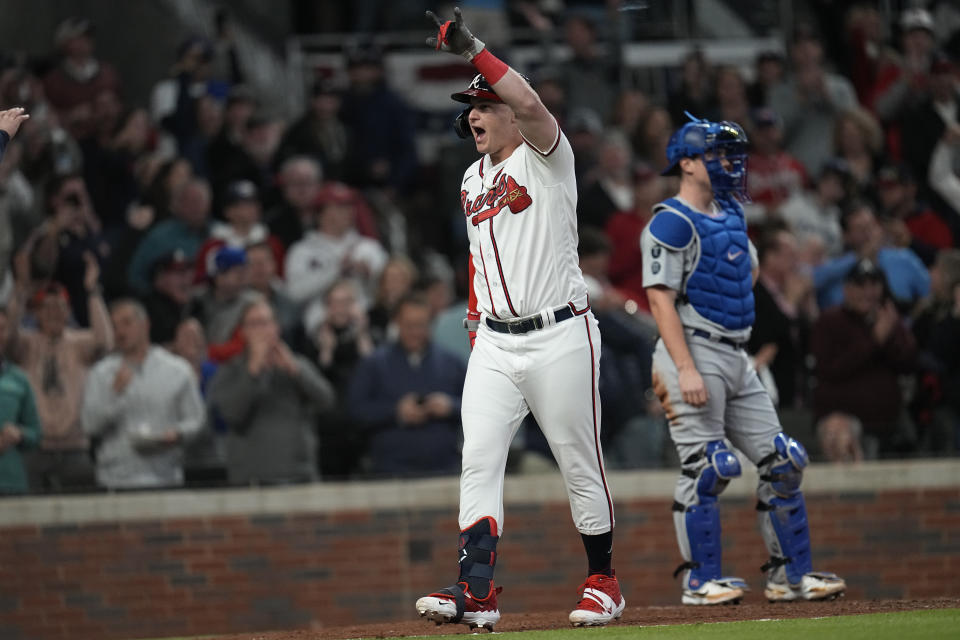 Atlanta Braves' Joc Pederson celebrates after hitting a two-run home run during the fourth inning in Game 2 of baseball's National League Championship Series against the Los Angeles Dodgers Sunday, Oct. 17, 2021, in Atlanta. (AP Photo/Ashley Landis)