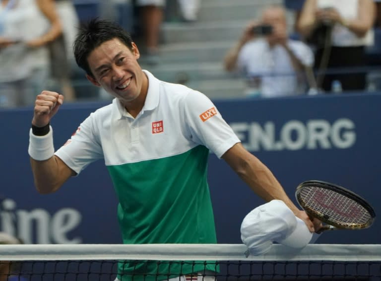 On the upswing: Kei Nishikori celebrates his US Open quarter-final victory over Marin Cilic