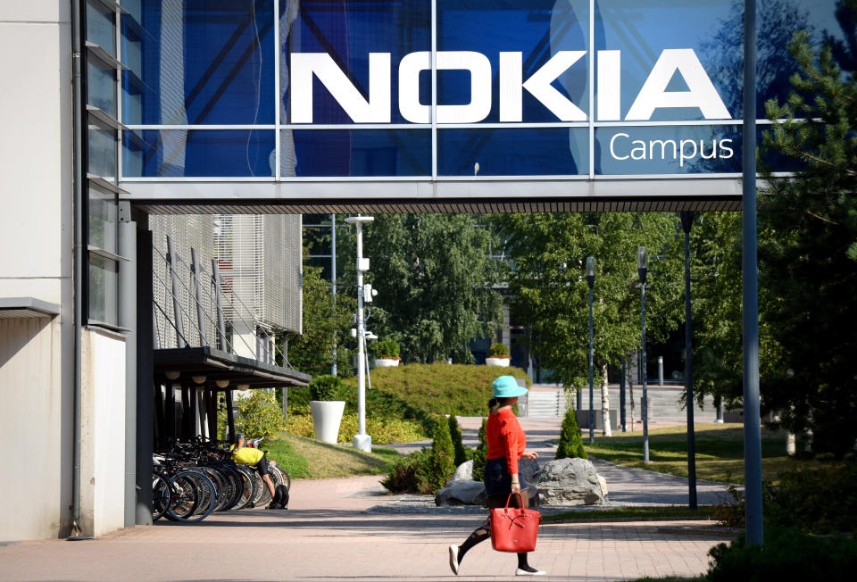 FILE - In this July 26, 2018 file photo, a woman walks at the headquarters of Finnish telecommunication network company Nokia in Espoo, Finland. Nokia says it has been tapped by NASA to build the first cellular communications network on the moon. The Finnish telecommunications equipment maker said Monday, Oct. 19, 2020, its Nokia Bell Labs’ division will build a 4G communications system to be deployed on a lunar lander to the Moon’s surface in late 2022. (Mikko Stig/Lehtikuva via AP, File)