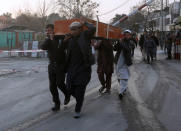 <p>Men carry a victim’s casket at the site of a car bomb attack in Kabul, Afghanistan , Jan. 27, 2018. (Photo: Omar Sobhani/Reuters) </p>