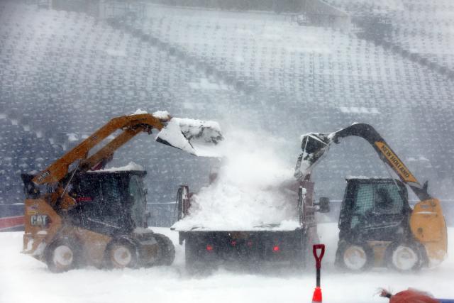 Bills fans help shovel as 18 inches of snow falls at Highmark Stadium