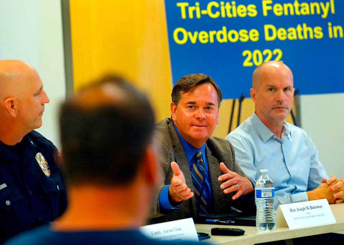 Benton Franklin Superior Court Judge Joseph Burrowes proudly acknowledges drug court graduate Shaun Lettrick during the fentanyl roundtable discussion hosted by Sen. Maria Cantwell in Kennewick.