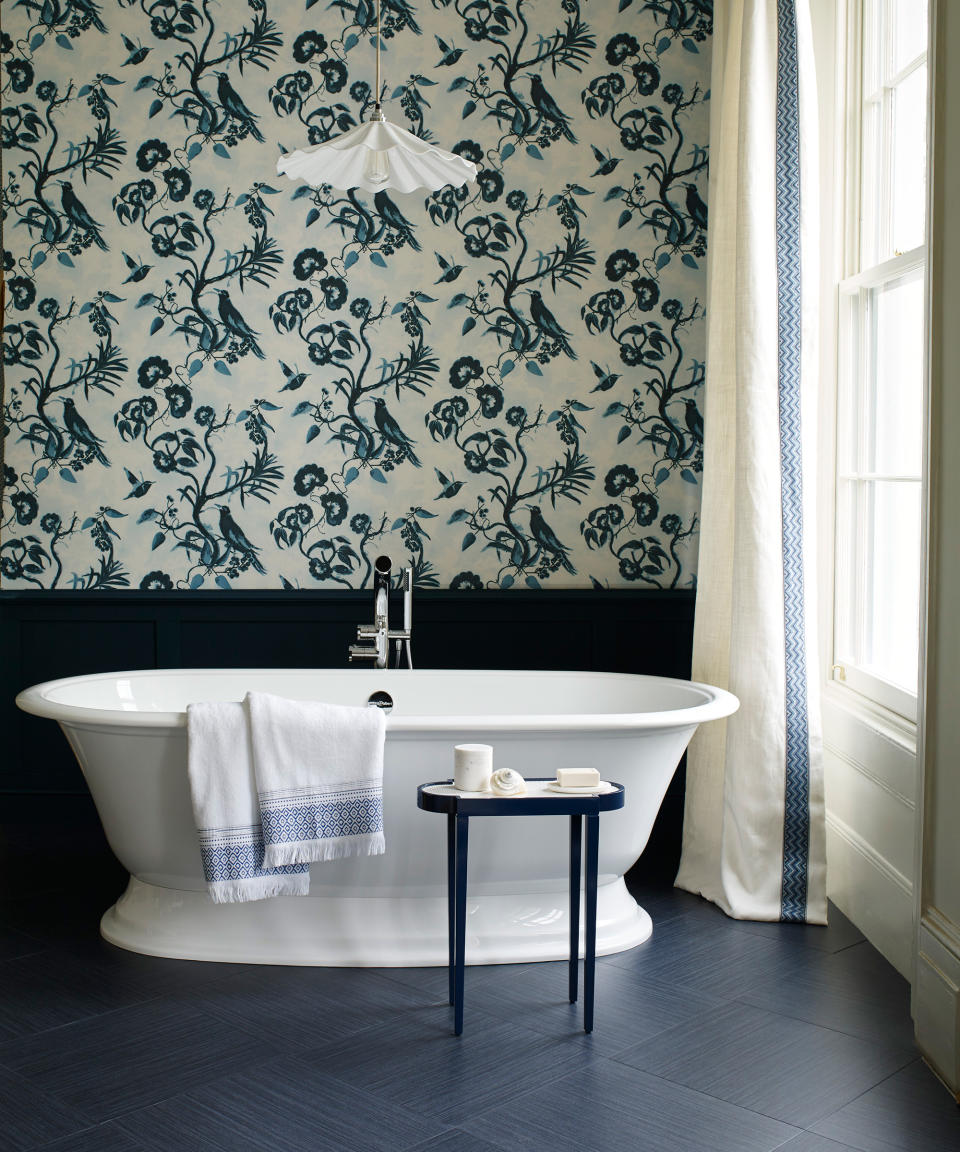 <p> Mixing and matching delicate designs and bold motifs can have remarkably different effects, depending on how they are used.&#xA0; </p> <p> In this inviting bathroom, the block color of the wall panelling and floor allows a wonderfully whimsical wallpaper with a strong motif to shine.&#xA0;Meanwhile, understated border details on the curtain and the towels help to pull the look together for a cohesive feel.&#xA0; </p>