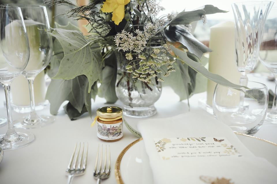 Each place card was tied with yellow ribbon onto a pot of honey from my father’s bee hives, with a watercolor of the house on the label painted by a friend.