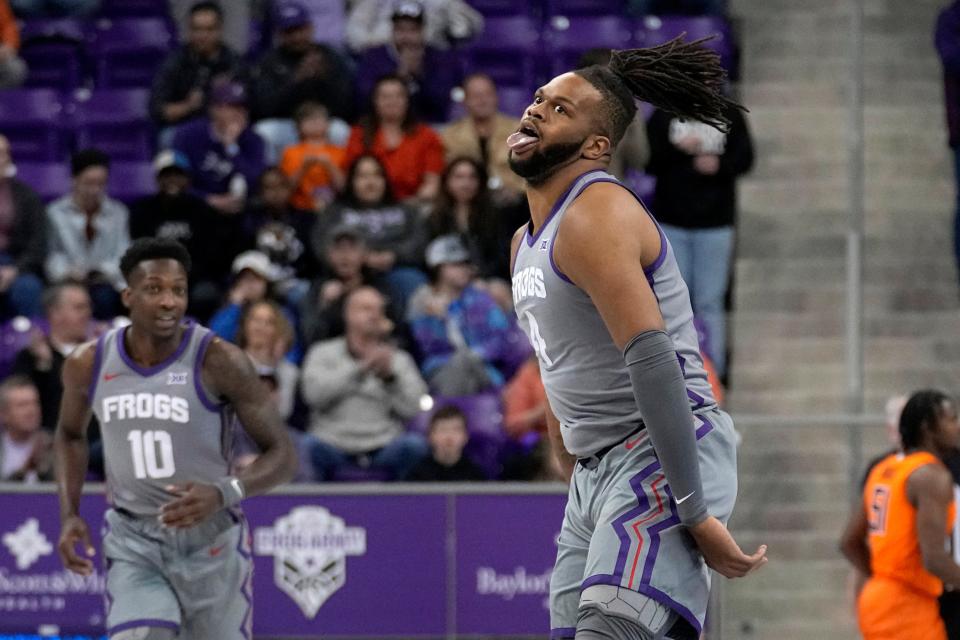 TCU center Eddie Lampkin Jr. (4) celebrates after sinking a three-point shot in the first half of an NCAA college basketball game against Oklahoma State, Saturday, Feb. 18, 2023, in Fort Worth, Texas. (AP Photo/Tony Gutierrez)