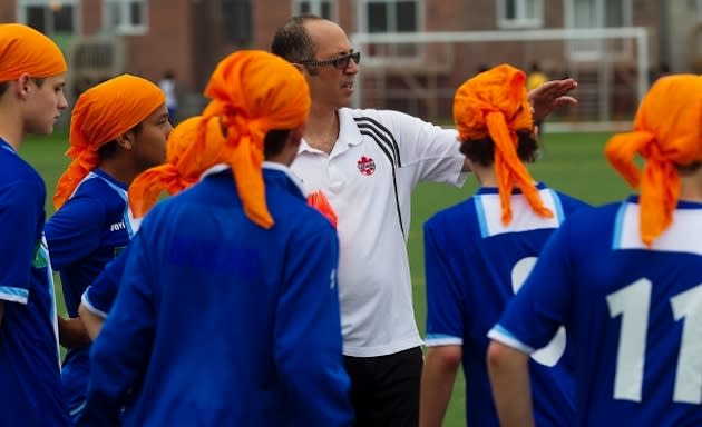 The FC Brossard team practices while wearing turbans in support of banned Sikh peers — Canadian Press/Montreal Gazette