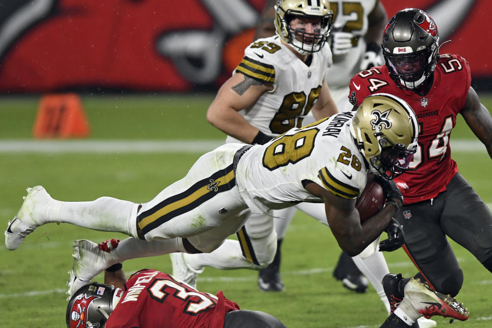 New Orleans Saints running back Latavius Murray (28) is upended by Tampa Bay Buccaneers strong safety Antoine Winfield Jr. (31) during the second half of an NFL football game Sunday, Nov. 8, 2020, in Tampa, Fla. (AP Photo/Jason Behnken)