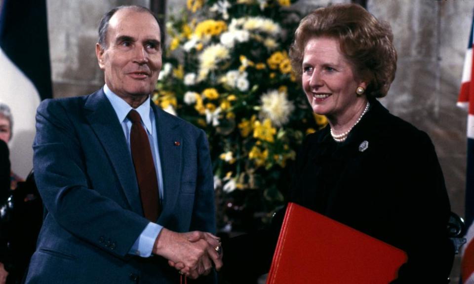 Francois Mitterrand and Margaret Thatcher shake hands at the signing of the Channel Tunnel agreement in Canterbury Cathedral on 12 February 1986.