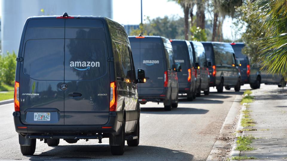 Delivery trucks line up outside the Amazon distribution center on Commerce Drive in Venice, Fla.