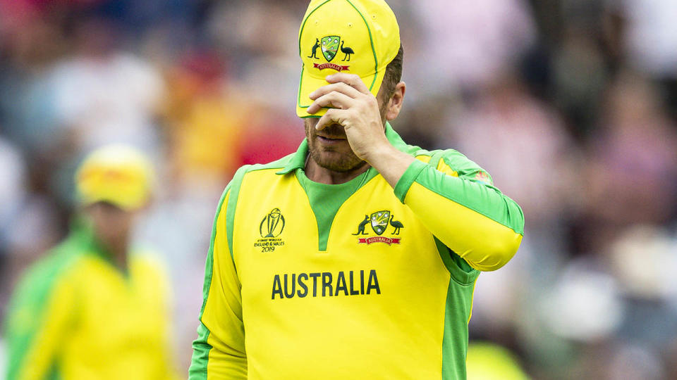 Aaron Finch couldn't look as the Aussies crashed out. (Photo by Andy Kearns/Getty Images)