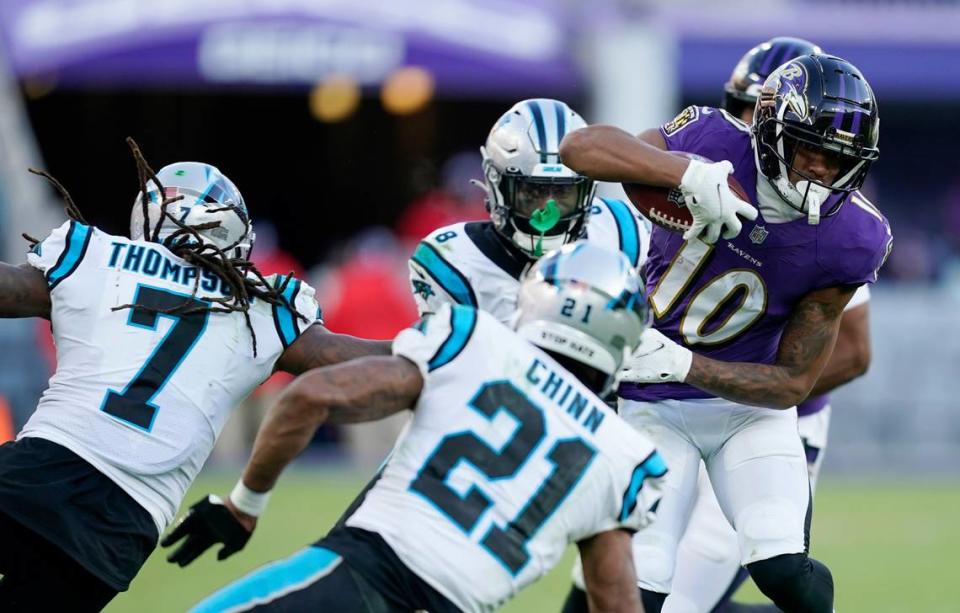 Baltimore Ravens wide receiver Demarcus Robinson (10) tries to get by Carolina Panthers safety Jeremy Chinn (21) and teammate Shaq Thompson (7) in the second half of an NFL football game Sunday, Nov. 20, 2022, in Baltimore. (AP Photo/Patrick Semansky) Patrick Semansky/AP