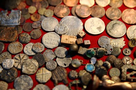 A collection of Tudor coins excavated from the River Thames by mudlark Jason Sandy is displayed at his home in London, Britain June 01, 2016. REUTERS/Neil Hall