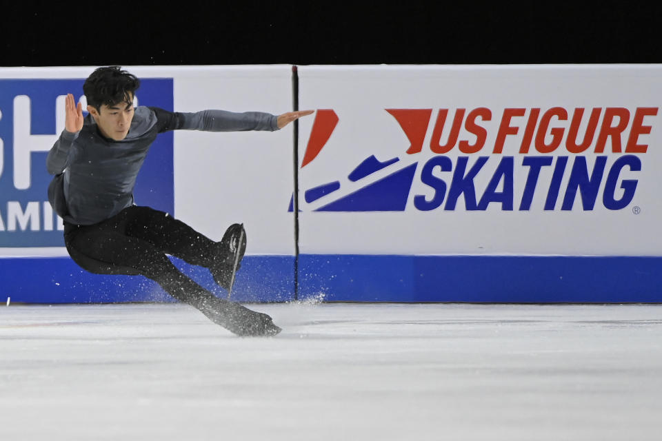 Nathan Chen falls during the men's short program at the Skate America figure skating event Friday, Oct. 22, 2021, in Las Vegas. (AP Photo/David Becker)