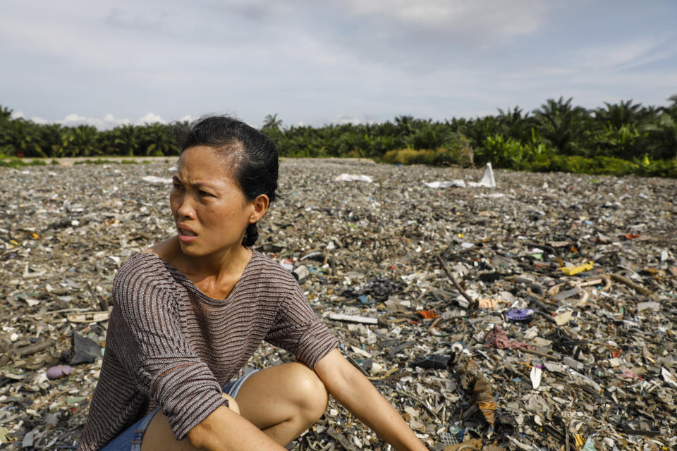 A local activist shows HuffPost an illegal plastic dumpsite&nbsp;hidden inside a palm oil plantation in Kuala Langat, Malaysia, in early 2019.&nbsp; (Photo: Joshua Paul for HuffPost)