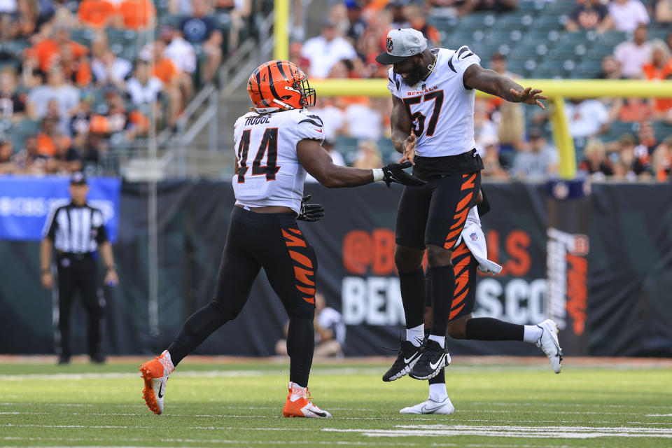 Cincinnati Bengals linebacker Darius Hodge (44) celebrates a sack with linebacker Germaine Pratt (57) in the second half of an NFL exhibition football game against the Miami Dolphins in Cincinnati, Sunday, Aug. 29, 2021. (AP Photo/Aaron Doster)