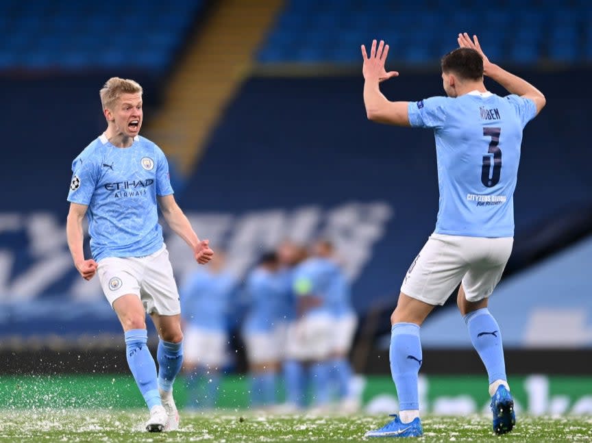 Defenders Oleksandr Zinchenko and Ruben Dias celebrate (Getty Images)