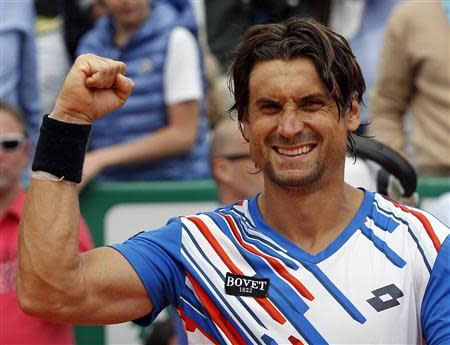 David Ferrer of Spain celebrates after defeating his compatriot Rafael Nadal during their quarter-final match at the Monte Carlo Masters in Monaco April 18, 2014. REUTERS/Eric Gaillard