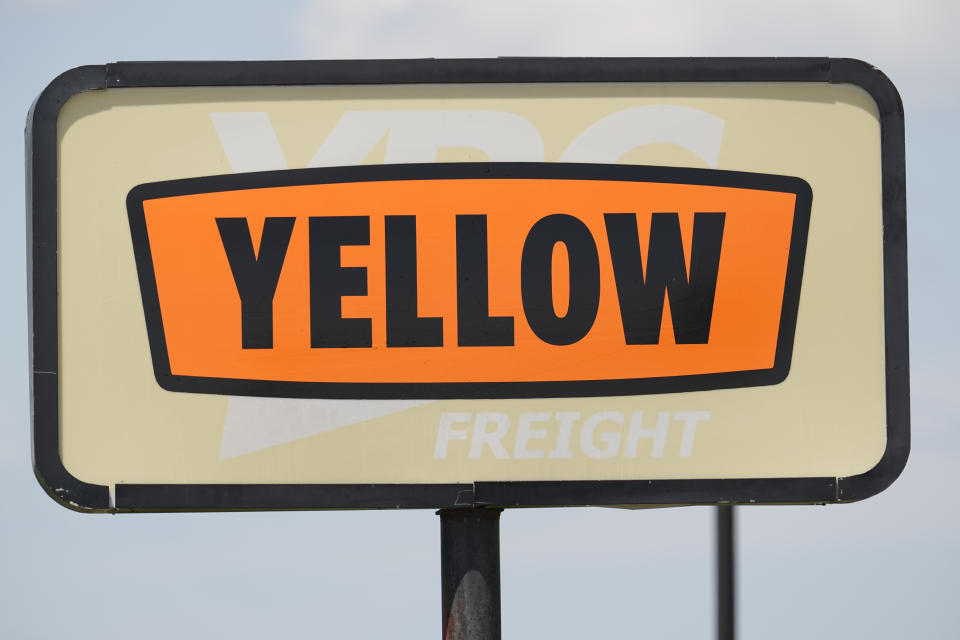 A sign for Yellow Corp. trucking company stands outside its facility Monday, July 31, 2023 in Nashville, Tenn. The troubled trucking company is shutting down and filing for bankruptcy, the Teamsters said Monday. An official bankruptcy filing is expected any day for Yellow, after years of financial struggles and growing debt. (AP Photo/George Walker IV)