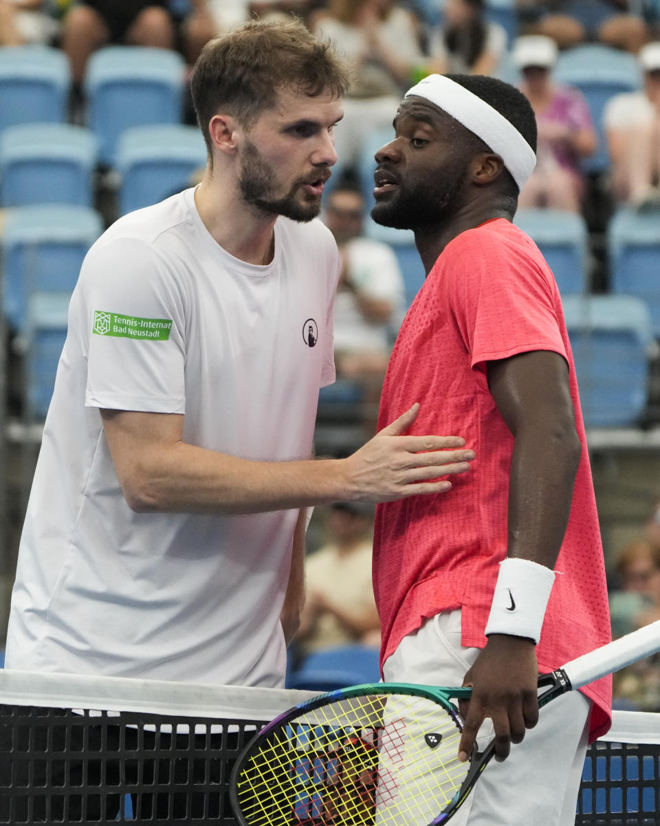 United States' Frances Tiafoe, right, is congratulated by Germany's Oscar Otte following during their Group C match at the United Cup tennis event in Sydney, Australia, Tuesday, Jan. 3, 2023. (AP Photo/Mark Baker)