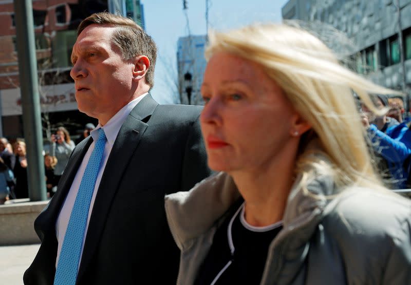 FILE PHOTO: John Wilson, of Hyannis Port, Massachusetts founder and CEO of a private equity and real estate development fund, facing charges in a nationwide college admissions cheating scheme, enters federal court in Boston