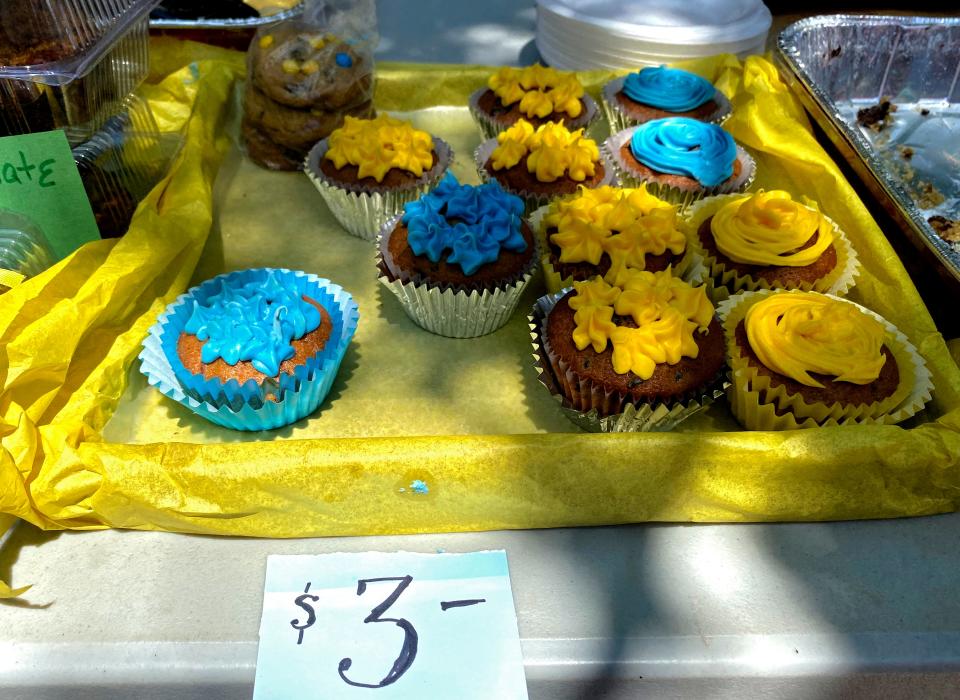 Cupcakes featuring icing in the Ukrainian flag colors of blue and yellow are sold during a bake sale hosted by St. Mary Ukrainian Orthodox Church at Zero Tolerance Coffee and Chocolate, 913 W Britton Road.