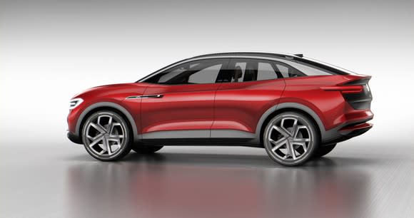 The Volkswagen I.D. Crozz II Concept, a red crossover SUV with a curved roof.