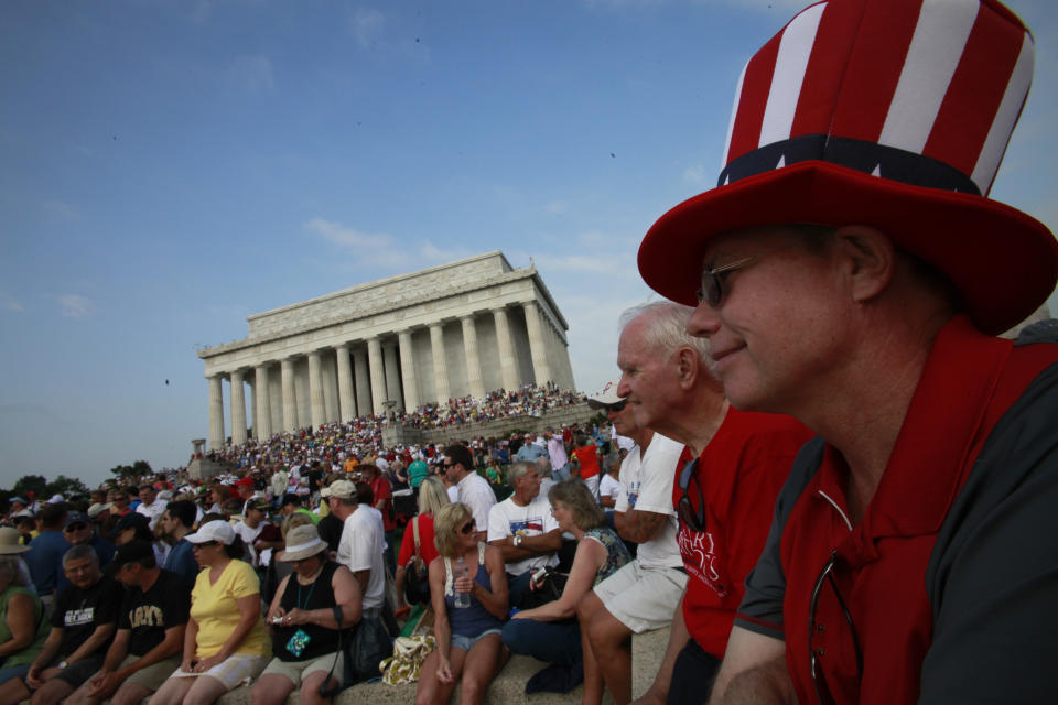 FILE - James Johnson, of Delray Beach, Fla., right, attends the "Restoring Honor" rally, organized by Glenn Beck, near the Lincoln Memorial in Washington, on Saturday, Aug. 28, 2010. (AP Photo/Jacquelyn Martin, File)