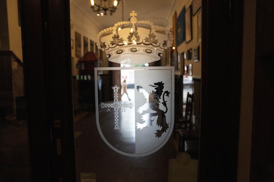 A coat of arms decorates the door of the Spanish restaurant Paxapoga in Buenos Aires, Argentina, Tuesday, May 21, 2024. A diplomatic crisis between historic allies Spain and Argentina expanded Tuesday as Spain announced the official withdrawal of its ambassador. (AP Photo/Rodrigo Abd)