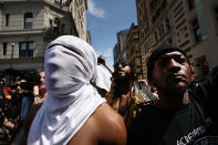 <p>Protesters face off with riot police escorting conservative activists following a march in Boston against a planned ‘Free Speech Rally’ just one week after the violent ‘Unite the Right’ rally in Virginia left one woman dead and dozens more injured on August 19, 2017 in Boston, Mass. (Photo: Spencer Platt/Getty Images) </p>