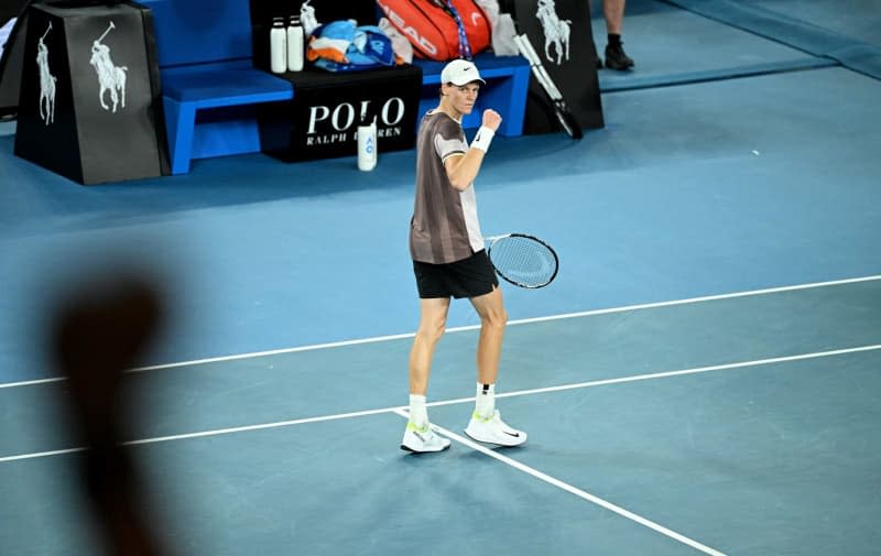 Italian tennis player Jannik Sinner reacts after winning the 4th set against Russia's Daniil Medvedev during their Men’s Singles final tennis match of the 2024 Australian Open at Melbourne Park. James Ross/AAP/dpa