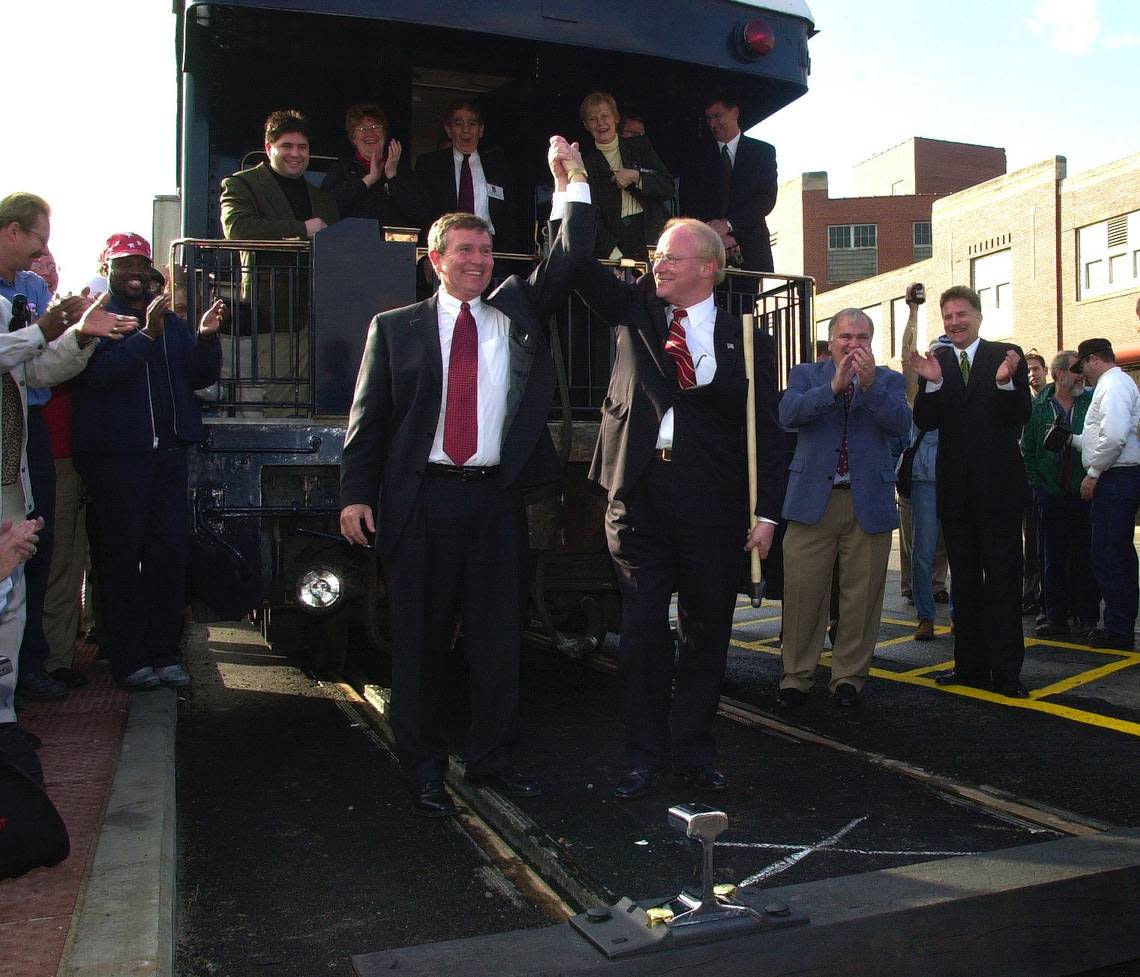 Extension of Amtrak Service to Louisville, Kentucky, Inaugural Trip, Tuesday, December 4, 2001, as Louisville’s Mayor and Jeffersonville, Indiana Mayor ride the train into Louisville’s Union Station. Don Saunders, Amtrak Intercity Acting President and Louisville’s Mayor Dave Armstrong, raise their hands in celebration after driving in the golden spike in todays ceremonies. Just at the right of Armstrong is Jeffersonville, Indiana’s Mayor Tom Gaffigan(blue coat) and next to him is Peter Gilbertson, Anacostia Rail Holdings Chairman. FRANK ANDERSON/LEXINGTON HERALD-LEADER
