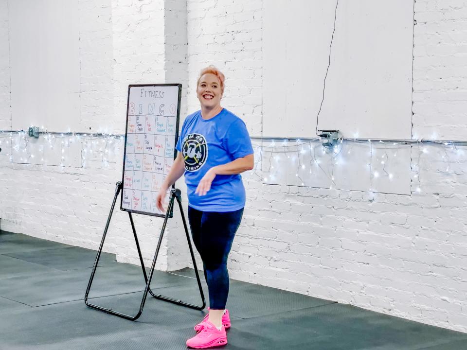 Samantha Hurst explains the rules of her Bingo-themed fitness class at a sample session at Kim Day Training on Dec. 11, 2022, Fountain City.