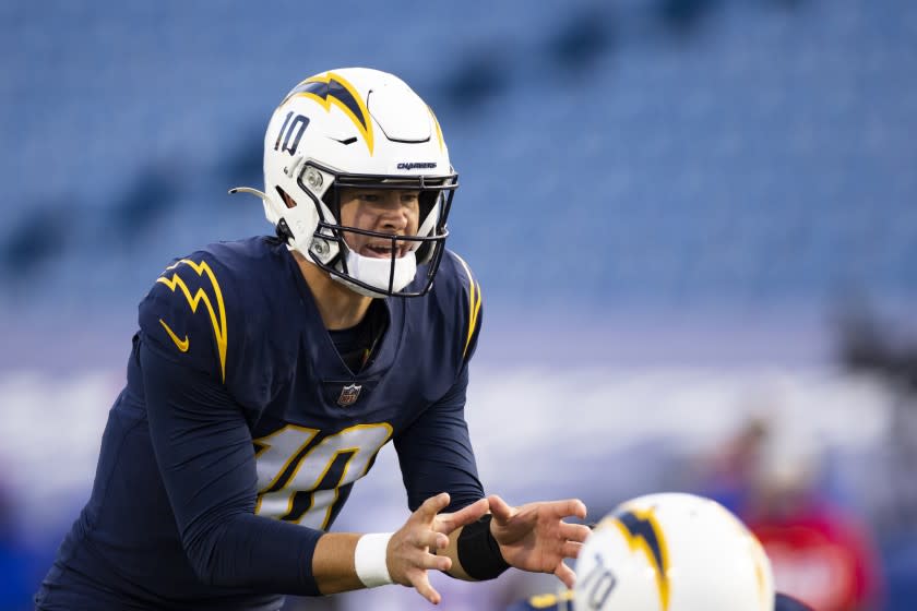 Los Angeles Chargers quarterback Justin Herbert (10) calls for a snap against the Buffalo Bills during the second half of an NFL football game, Sunday, Nov. 29, 2020, in Orchard Park, N.Y. (AP Photo/Brett Carlsen)