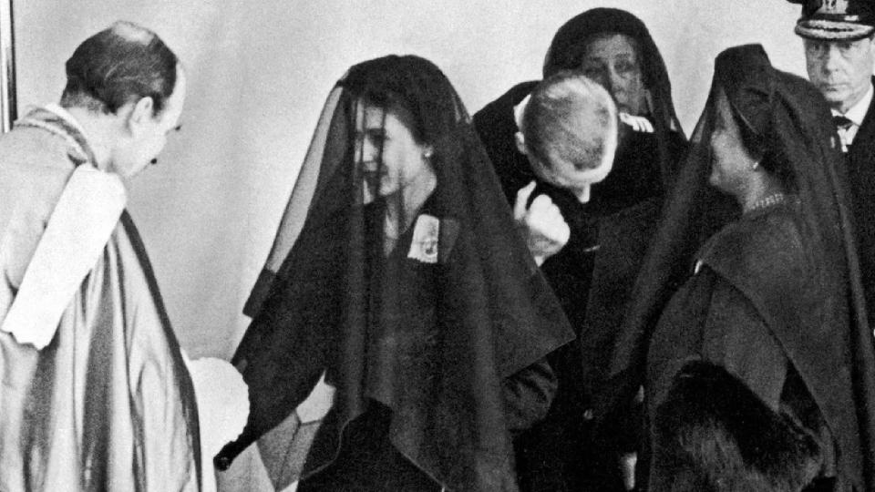 Queen Elizabeth II shakes hands with Eric Hamilton, Dean of Windsor at the funeral of her father King George VI