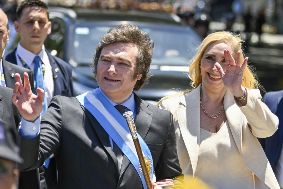 Accompanied by his sister Karina, Argentina's newly sworn-in President Javier Milei arrives to the government house in Buenos Aires, Argentina, Sunday, Dec. 10, 2023. (AP Photo/Julian Bongiovanni)