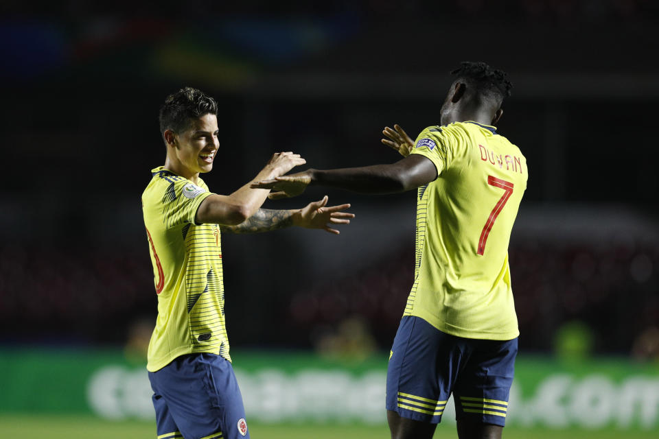 Colombia's Duvan Zapata, right, celebrates after scoring against Qatar with teammate Colombia's James Rodriguez during a Copa America Group B soccer match at the Morumbi stadium in Sao Paulo, Brazil, Wednesday, June 19, 2019. (AP Photo/Victor R. Caivano)