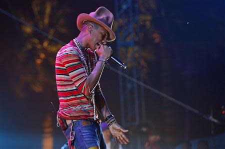 Pharrell Williams performs at the Coachella Valley Music and Arts Festival in Indio, California April 12, 2014. Picture taken April 12, 2014. REUTERS/Mario Anzuoni