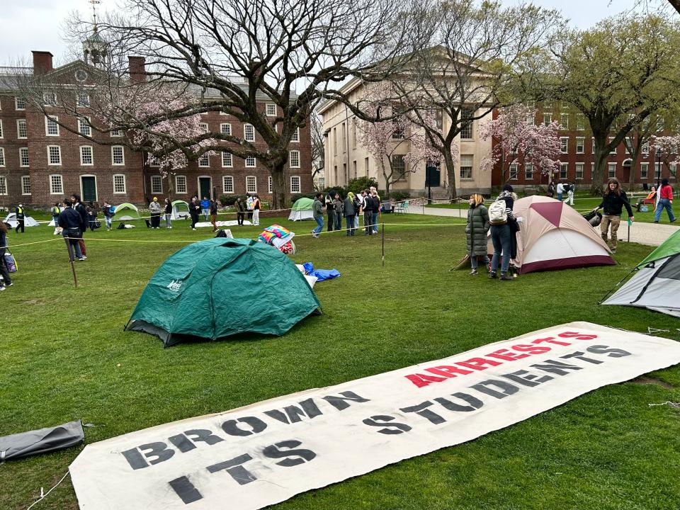 More than two dozen tents were set up on Brown University's main green Wednesday morning. Students have been warned of potential disciplinary action.