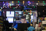 A stock trader works at the New York Stock Exchange, Tuesday, Dec. 3, 2019. Stocks fell broadly Tuesday after President Donald Trump cast doubt over the potential for a trade deal with China this year and threatened to impose tariffs on French goods. (AP Photo/Mark Lennihan)