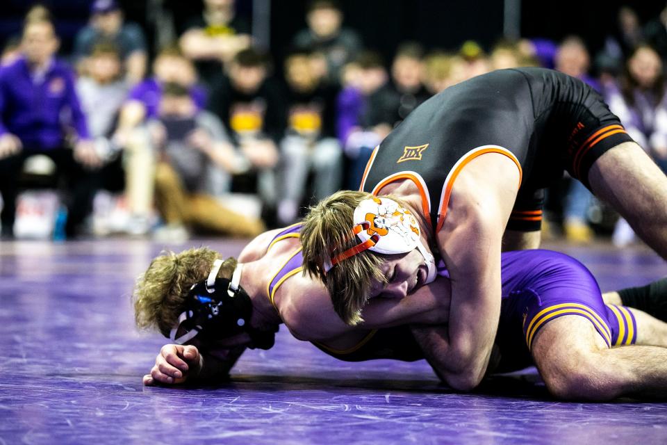 Oklahoma State's Carter Young, top, wrestles Northern Iowa's Cael Happel at 141 pounds on Jan. 28 at the McLeod Center in Cedar Falls.