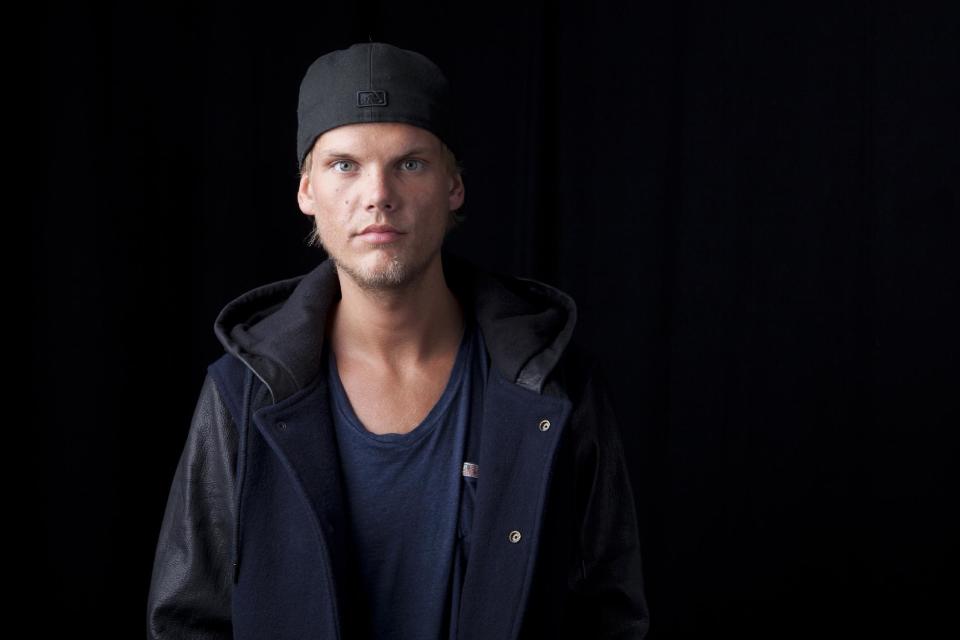 FILE - In this Aug. 30, 2013 file photo, Swedish DJ, remixer and record producer Avicii poses for a portrait, in New York. TomorrowWorld organizers are taking extra precaution to maintain a safe environment for concertgoers this weekend after two drug-related deaths occurred at a similar festival in New York earlier this summer. Top EDM acts from Avicii, David Guetta to Diplo are among 300 internationally renowned DJs and performers that will take to eight different stages at the three-day festival that kicks-off in South Fulton County in suburban Atlanta on Friday, Sept. 27, 2013. (Photo by Amy Sussman/Invision/AP, File)