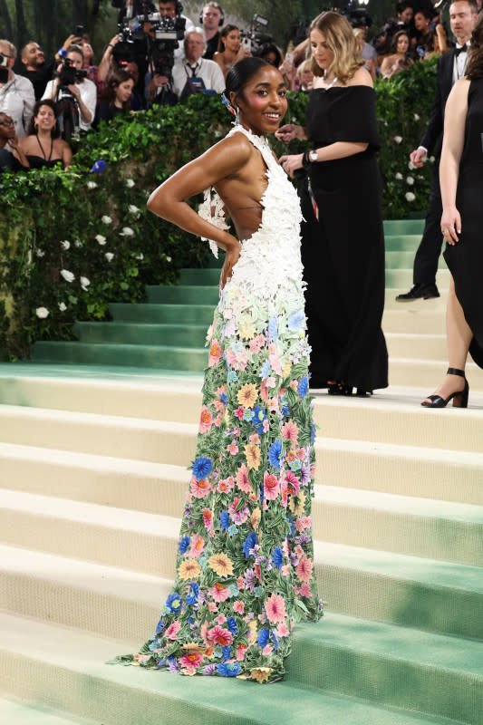 <p>Jamie McCarthy/Getty Images</p><p><em>The Bear</em>'s breakout star walked her first Met Gala red carpet in this white gown that descends into florals. </p>